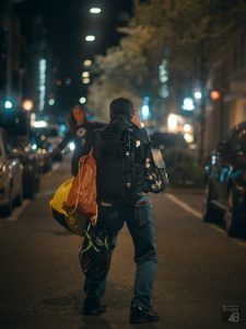 Photographer carrying many bags