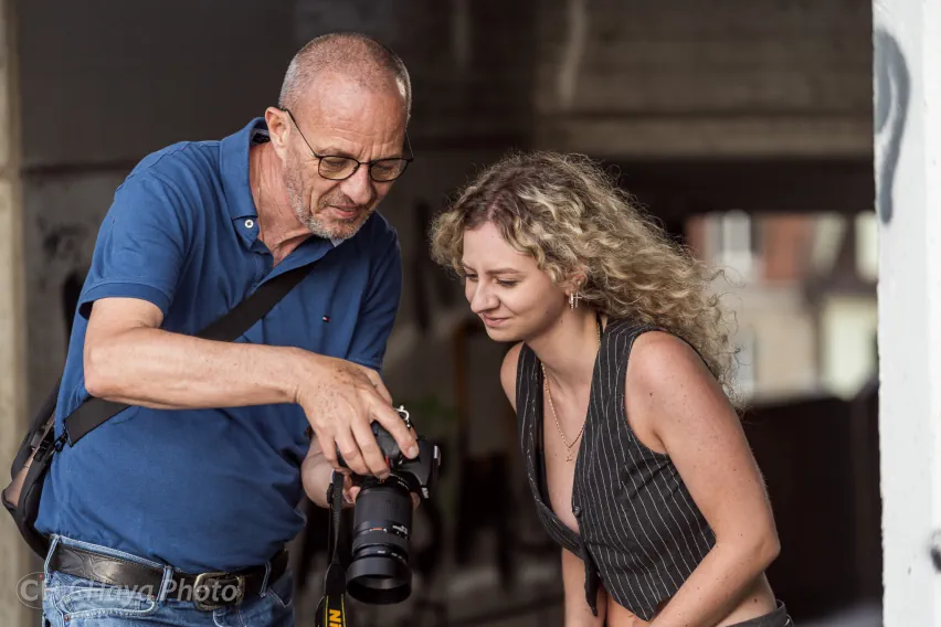 photographer and model checking the photos