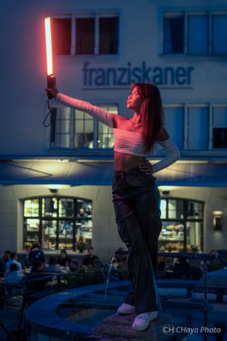 a model holding a light stick